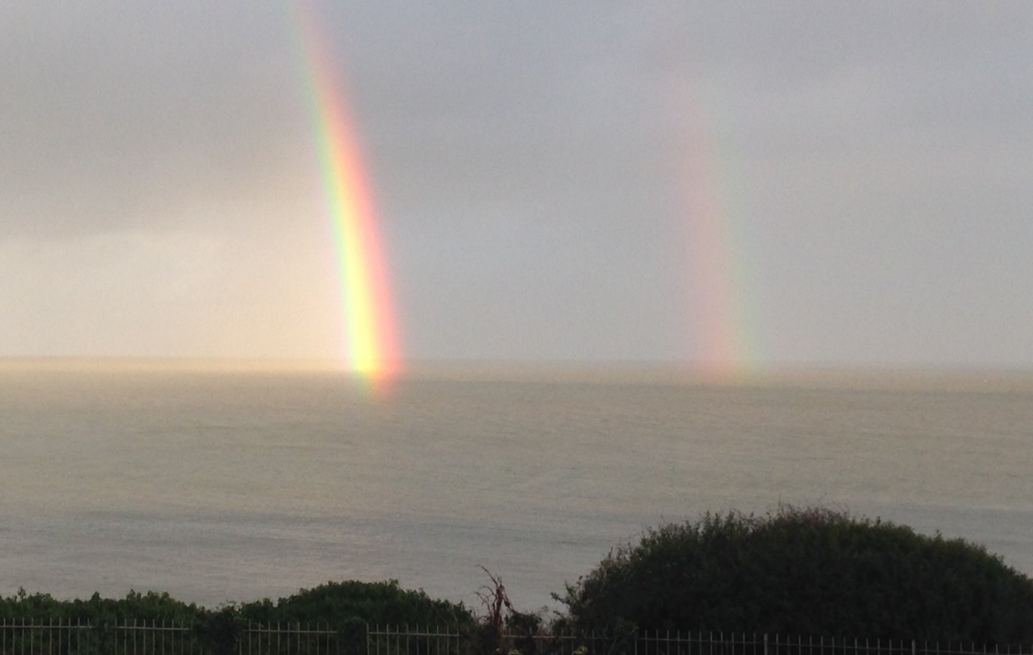 Teacher wellbeing rainbow over the sea