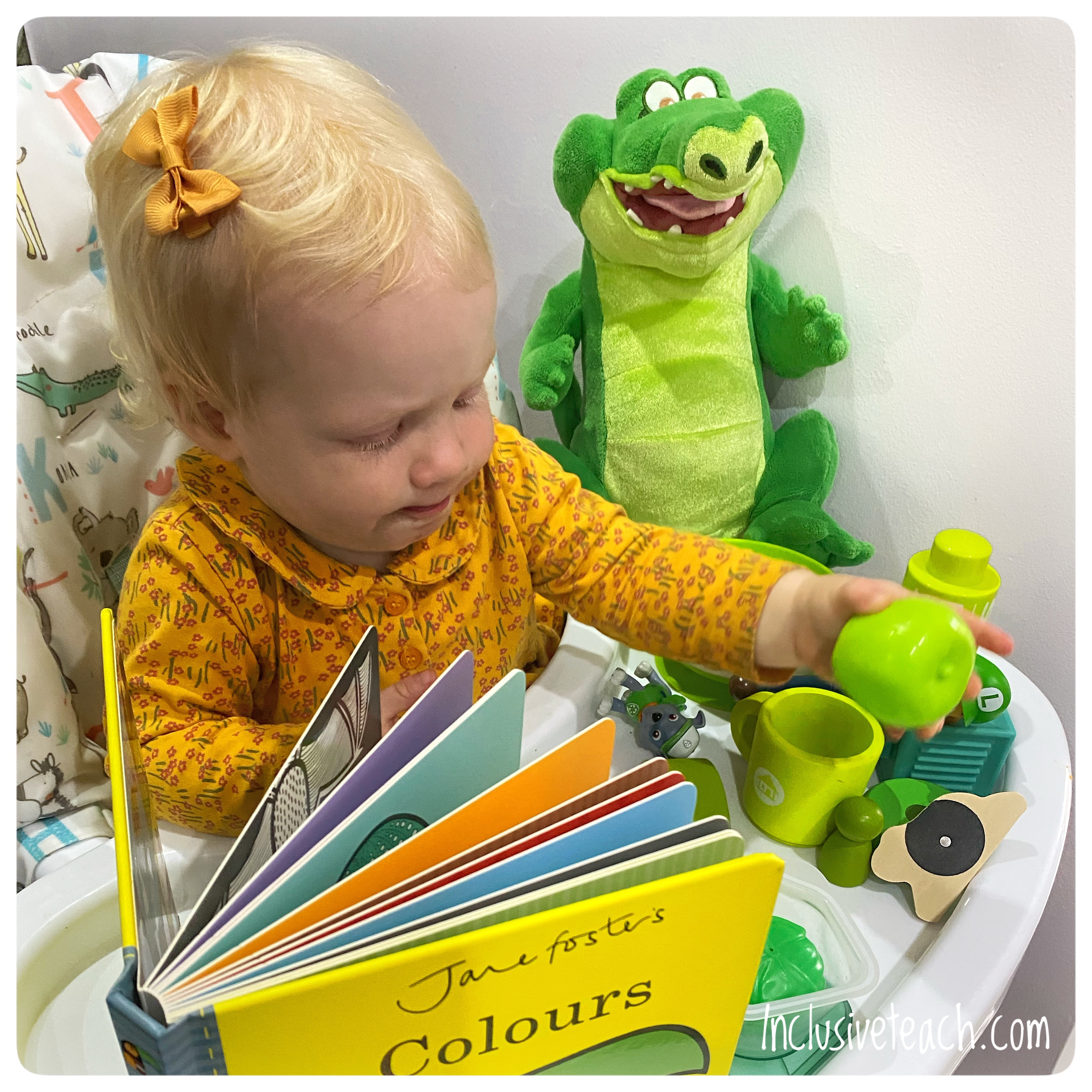 jane fosters colours book review baby books with baby sitting in high chair playing with green toys