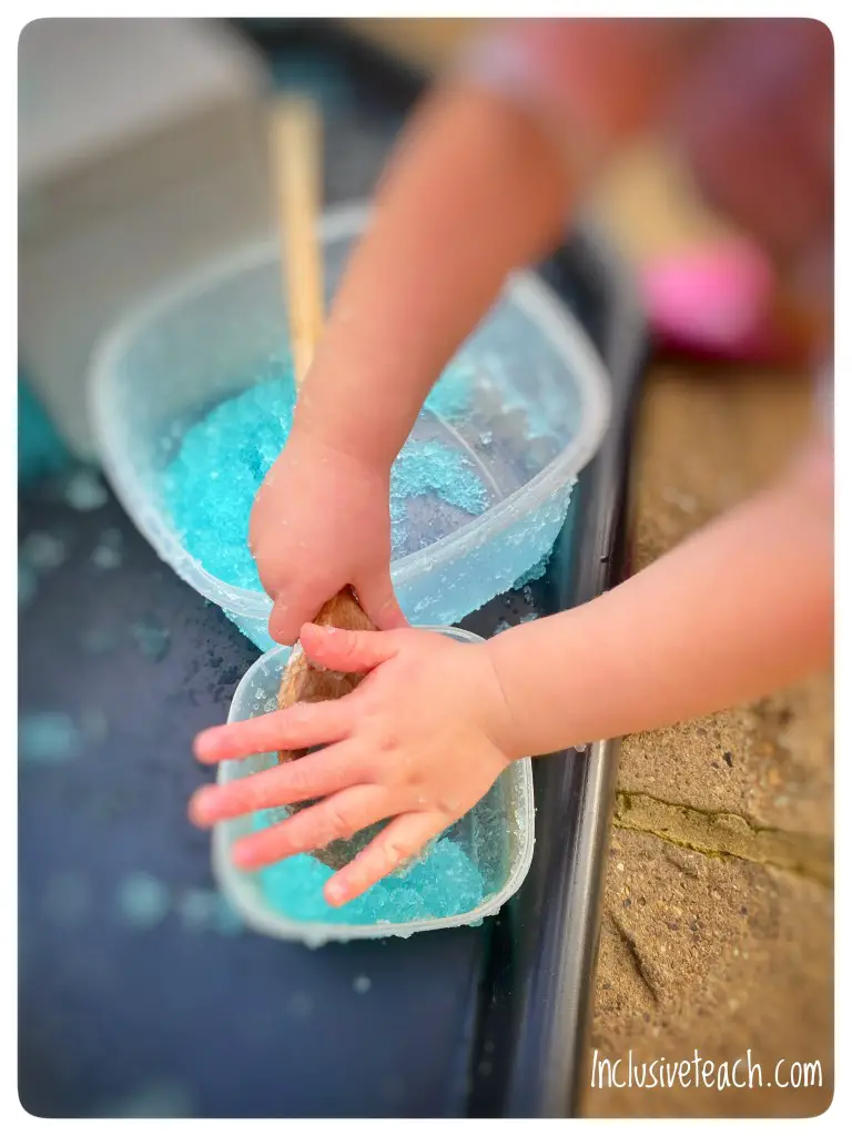 EYFS tough tray activities benefits of sensory play child mixing slime
