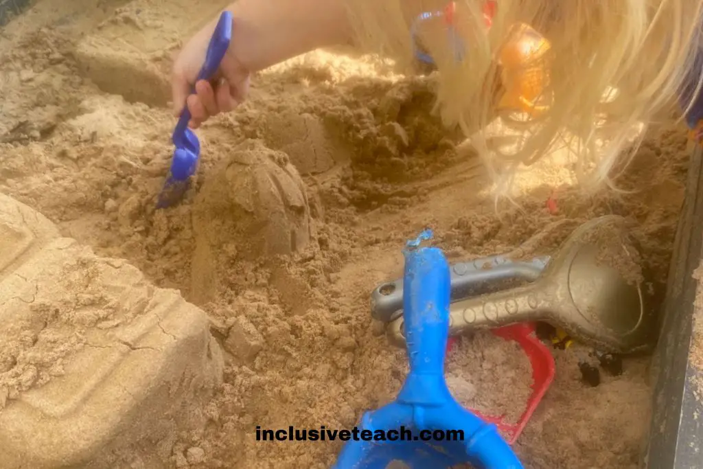 kinetic sand child playing EYFS autism